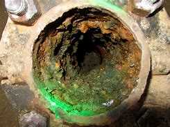 corroded interior of a main water service pipe